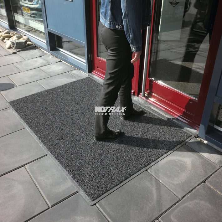 Wayfarer floor mat, dark textured rubber with low-profile raised pattern